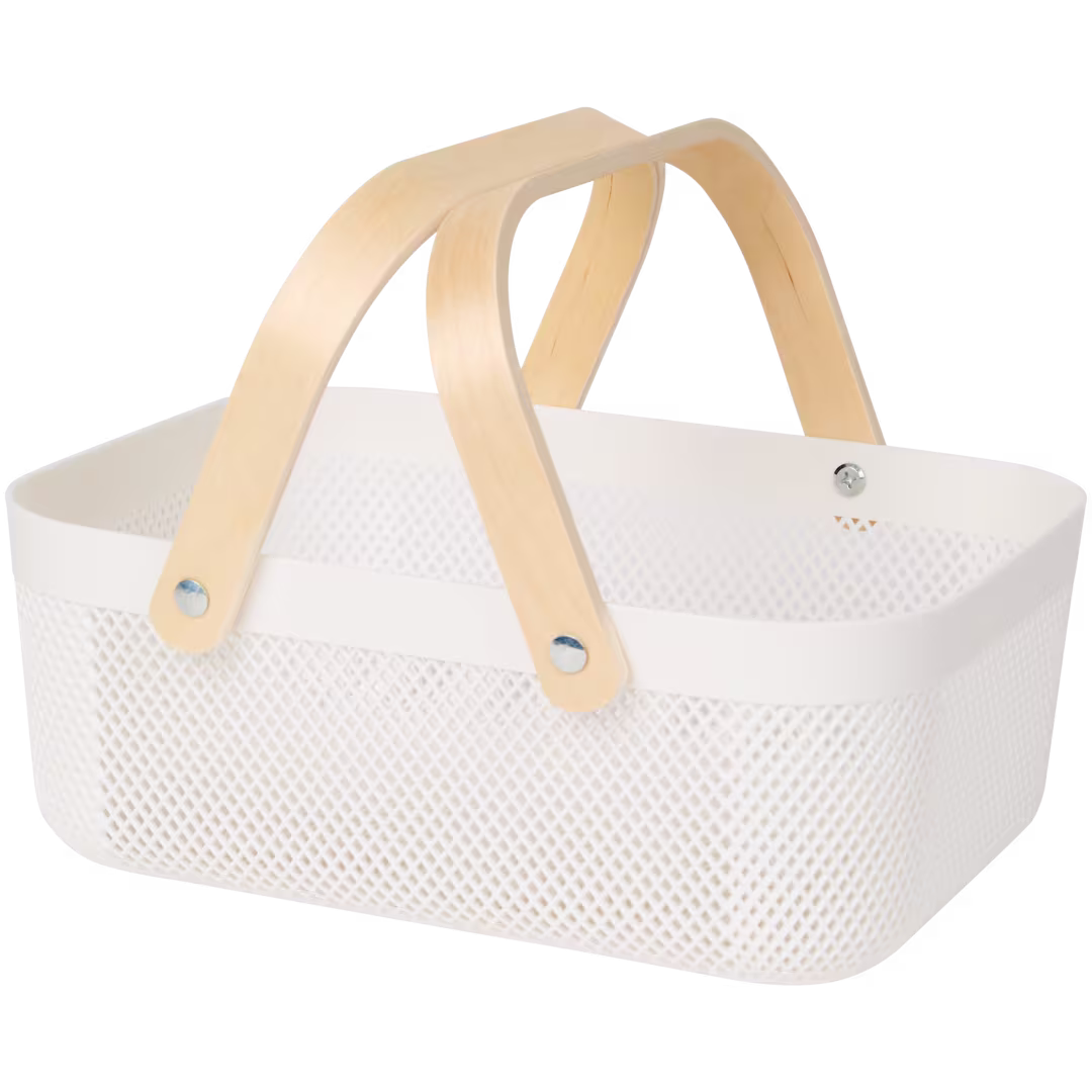 The KORG carrier: a white perforated basket with bentwood handles
